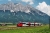 Поезд Бомбардир Талент (Bombardier Talent) в Альпах, Штирия, неподалёку от реки Энс, Австрия